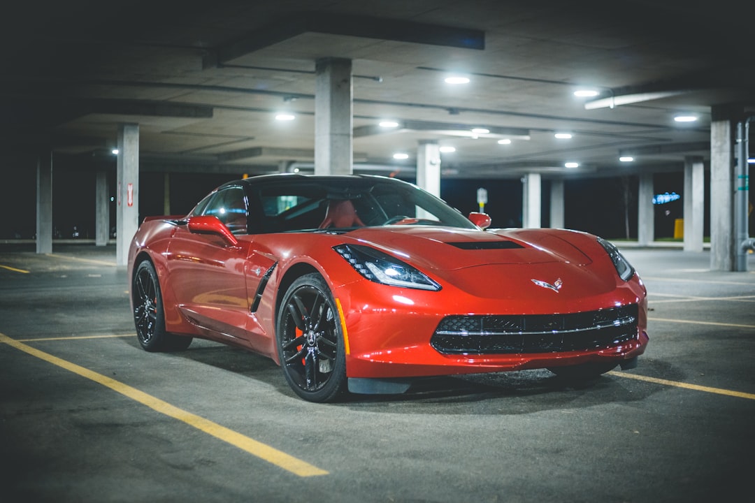 red ferrari 458 italia parked in a parking lot